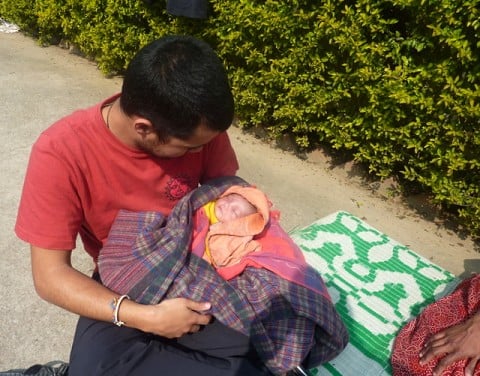 Orphan under a train seat